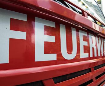 A fire truck with the inscription "FIRE BRIGADE". The bright red color is striking and eye-catching.