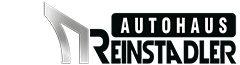 Ein Logo des Autohauses Reinstadler. Es zeigt eine stilisierte Fahrzeug- oder Gebäudeumriss mit modernem Schriftzug.