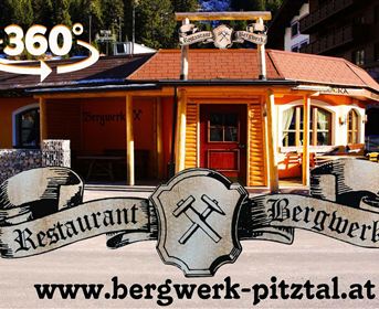 An inviting restaurant with a colorful facade and a charming design. It is located in a beautiful mountain landscape and offers a pleasant atmosphere.