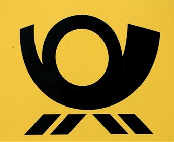 A black, stylized logo on a yellow background. It features a round shape with two side extensions and three parallel lines at the bottom.