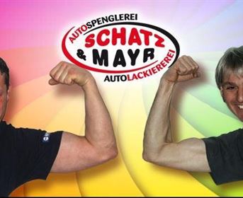 Two men are showing off their muscles in front of a colorful background. At the top, there is the logo of the company "Schatz & Mayr - Auto Painting".