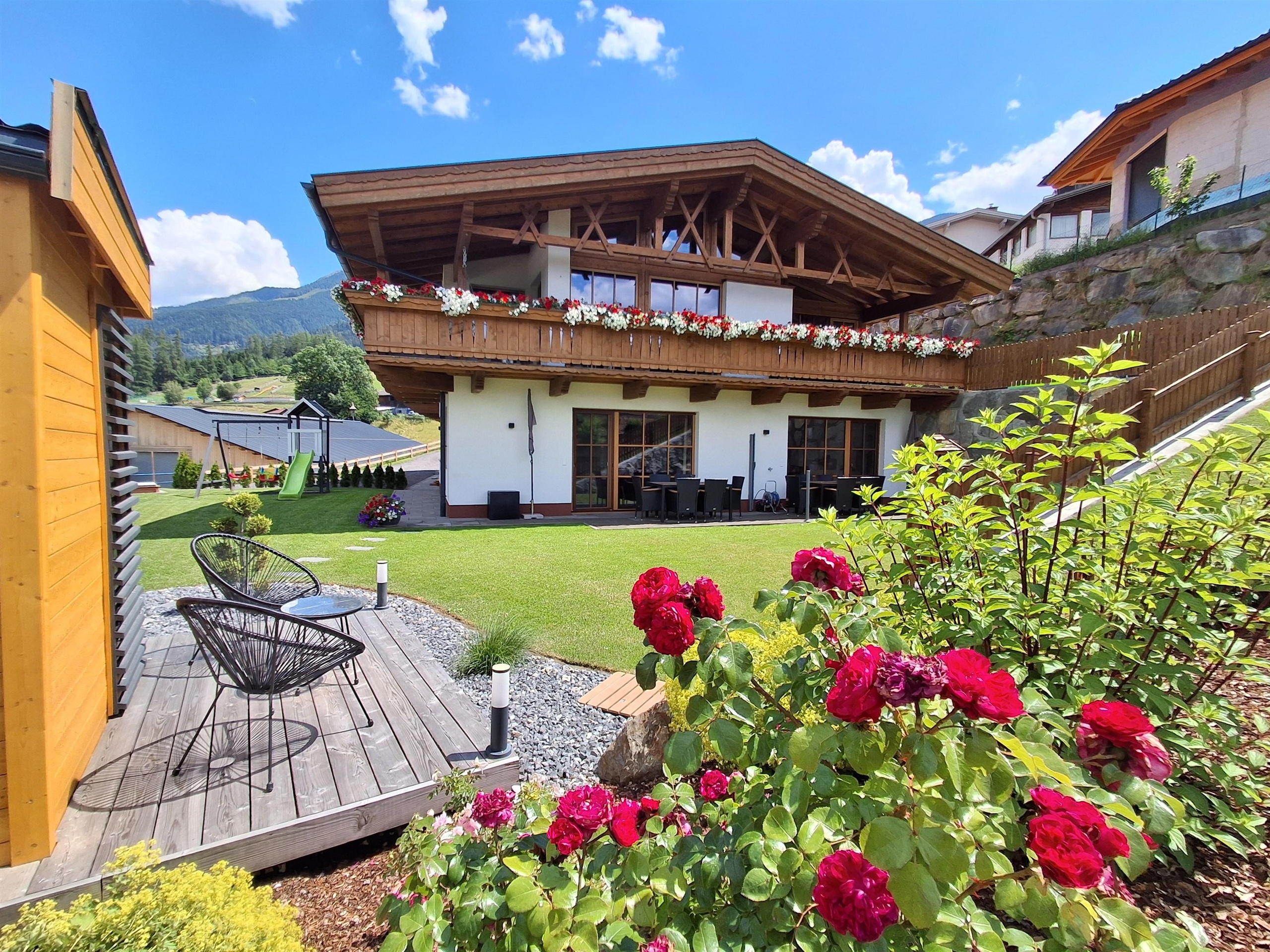 A beautiful, modern house with a large garden.
Colorful flowers and comfortable seating invite relaxation.