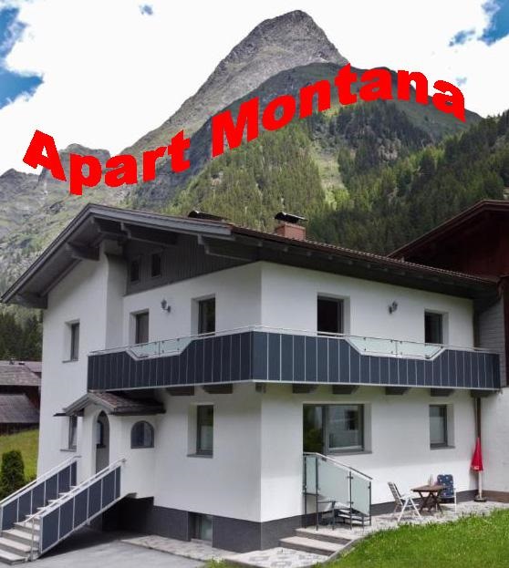 A modern building with a balcony, surrounded by mountains and forests. In the foreground, seating is visible.