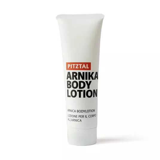 Eine Tube Pitzal Arnika Körperlotion mit schlichtem design. Ideal zur Pflege der Haut nach sportlichen Aktivitäten.