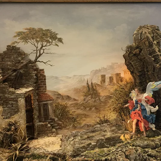 A fantastic landscape painting with ruinous buildings and a dramatic sky. In the foreground, there is a figure and an angel that bring the scene to life.
