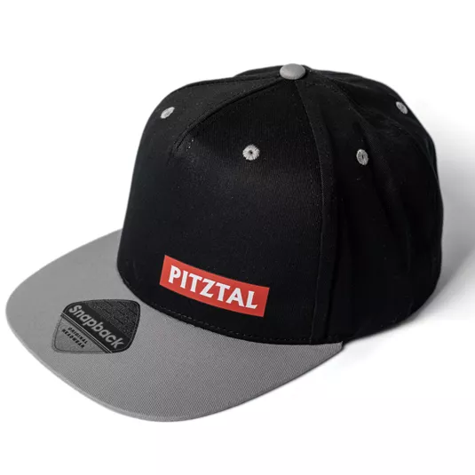 A black hood with a gray visor. On the front, there is a red logo with the inscription "PITZTAL".